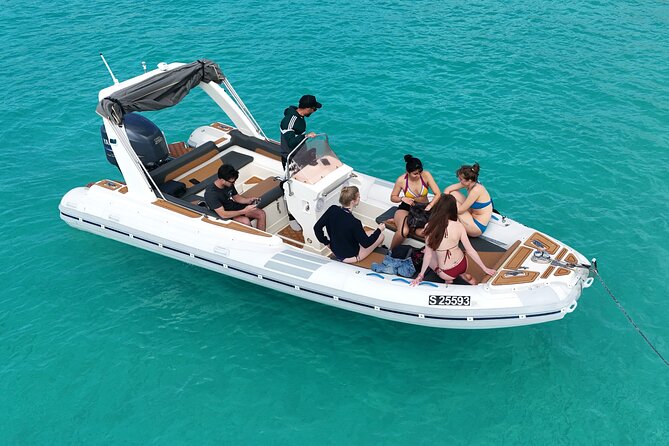 Blue Lagoon, Comino and Caves Tour with Private Rib Boat - Crystal Lagoon, cliffs, and the P31 wreck