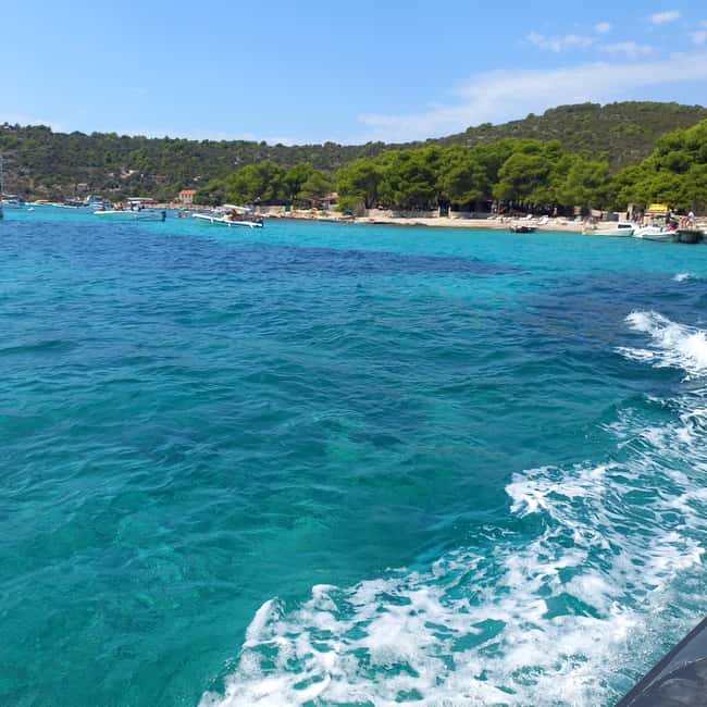 Blue lagoon with a speed boat water and towels included - A second swim at Labadusa Beach