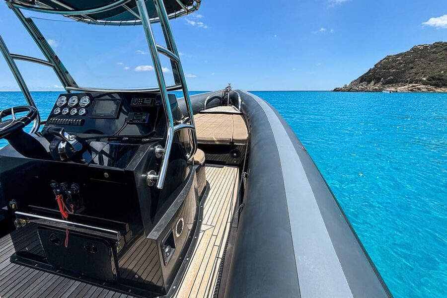 Cagliari: Zodiac Boat Tour, 3-4 SwimStops, Wine & Snorkeling - Cala Fighera brings clear water and cliff views