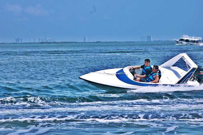 Cancun Adventure Speed Boat Jungle Tour with Transportation - Taking the wheel at SeaLife Marina