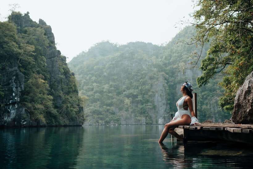 Coron: Private Island-Hopping Tour on a Yacht or Speedboat - Twin Lagoon beneath the limestone cliffs