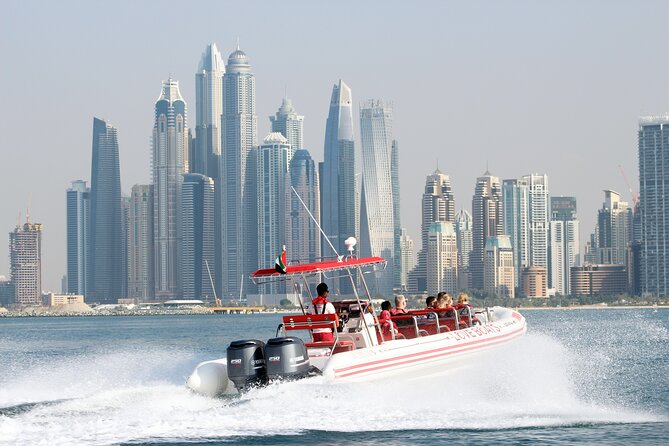Dubai Speedboat Tour: JBR Skyline, Atlantis, Burj AlArab Optional - Holding the rails on the Dubai Marina run
