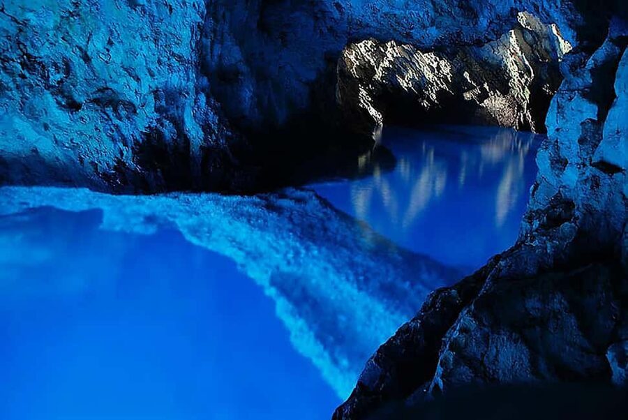 From Hvar: Blue cave group speedboat tour full day - The Blue Cave visit runs on local boats