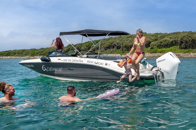 Luxury Speedboat Island Hopping with Swimming & Snorkeling - Red Island: a short walk, harbor, and castle tower