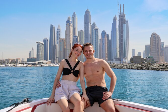 Luxury Sport Speed Boat Rental in Dubai - Skydive Dubai and Ain Dubai landmarks
