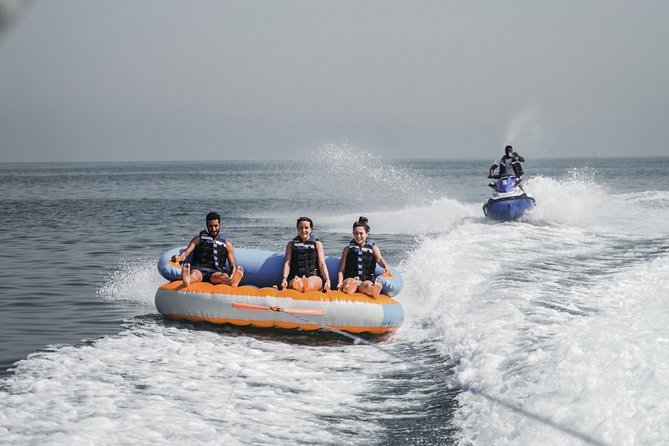 Private 60-min Group Tubing on Speedboat in Dubai - The Burj Al Arab view is part of the attraction