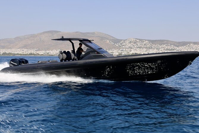 Santorini Caldera: Private Cruise with Speed Boat & Open Bar - Oia from below, plus Armeni and Skaros Rock