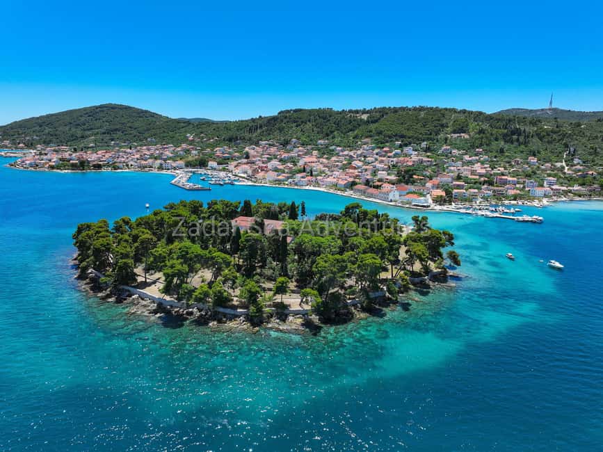 Zadar: Island Hopping Speedboat Adventure with Aperol Spritz - Stop one: a clear-water bay for swimming and snorkeling