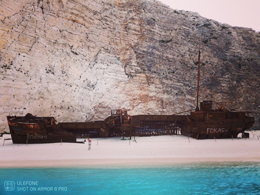Zante: Private Speedboat Cruise with Navagio Beach Stop - Finding the blue color inside the caves
